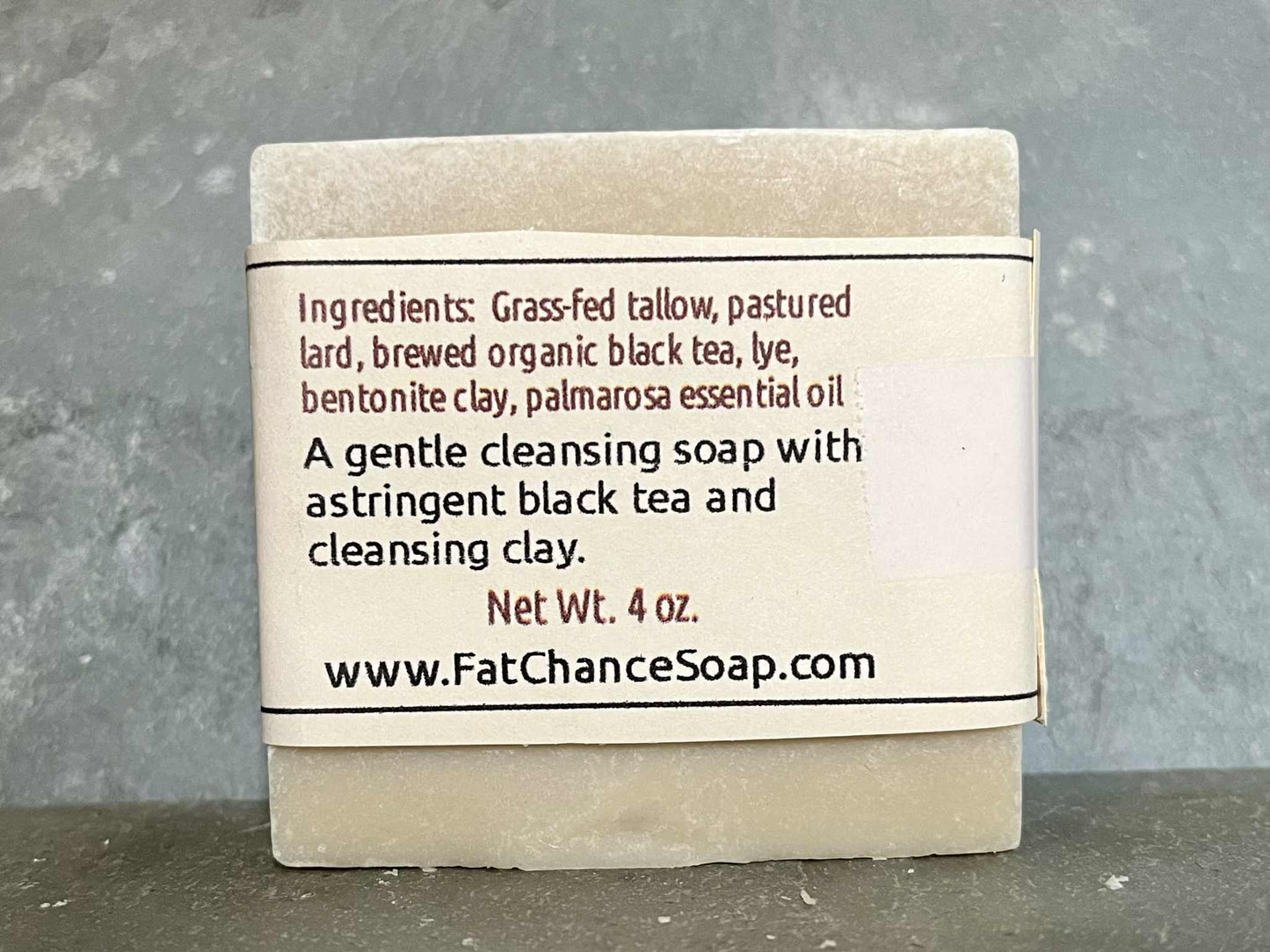 a bar of tallow and lard soap with added tea and clay