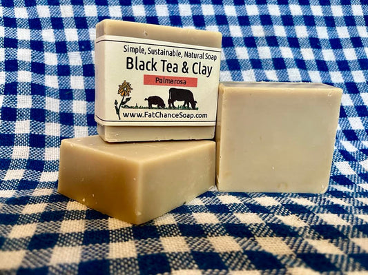 three bars of tallow and lard soap with added tea and clay