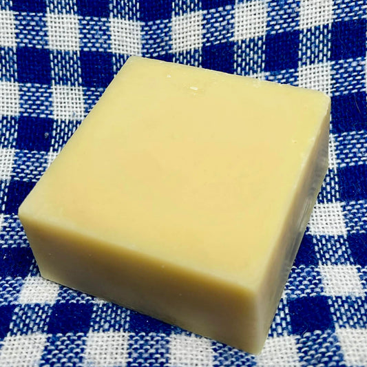 Bar of soap on a blue and white checkered fabric