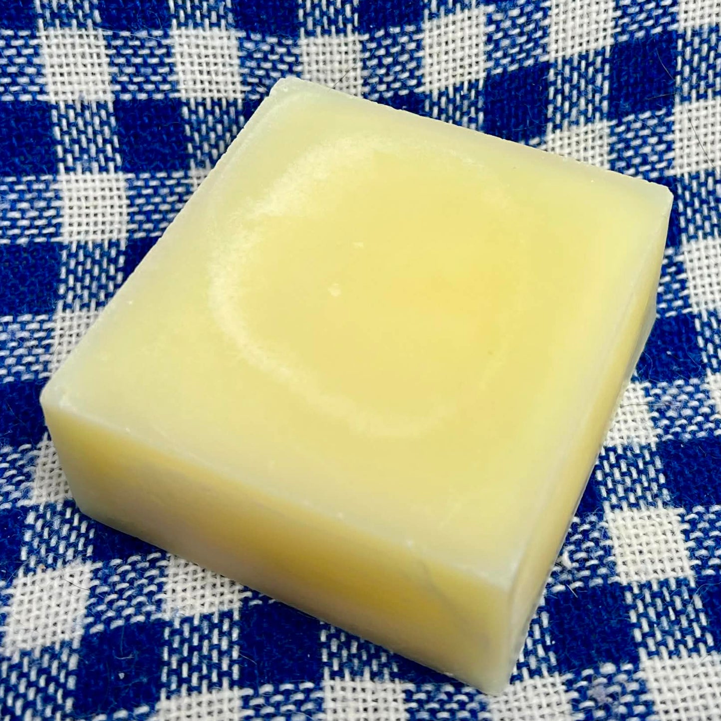 bar of soap on a blue and white checkered cloth