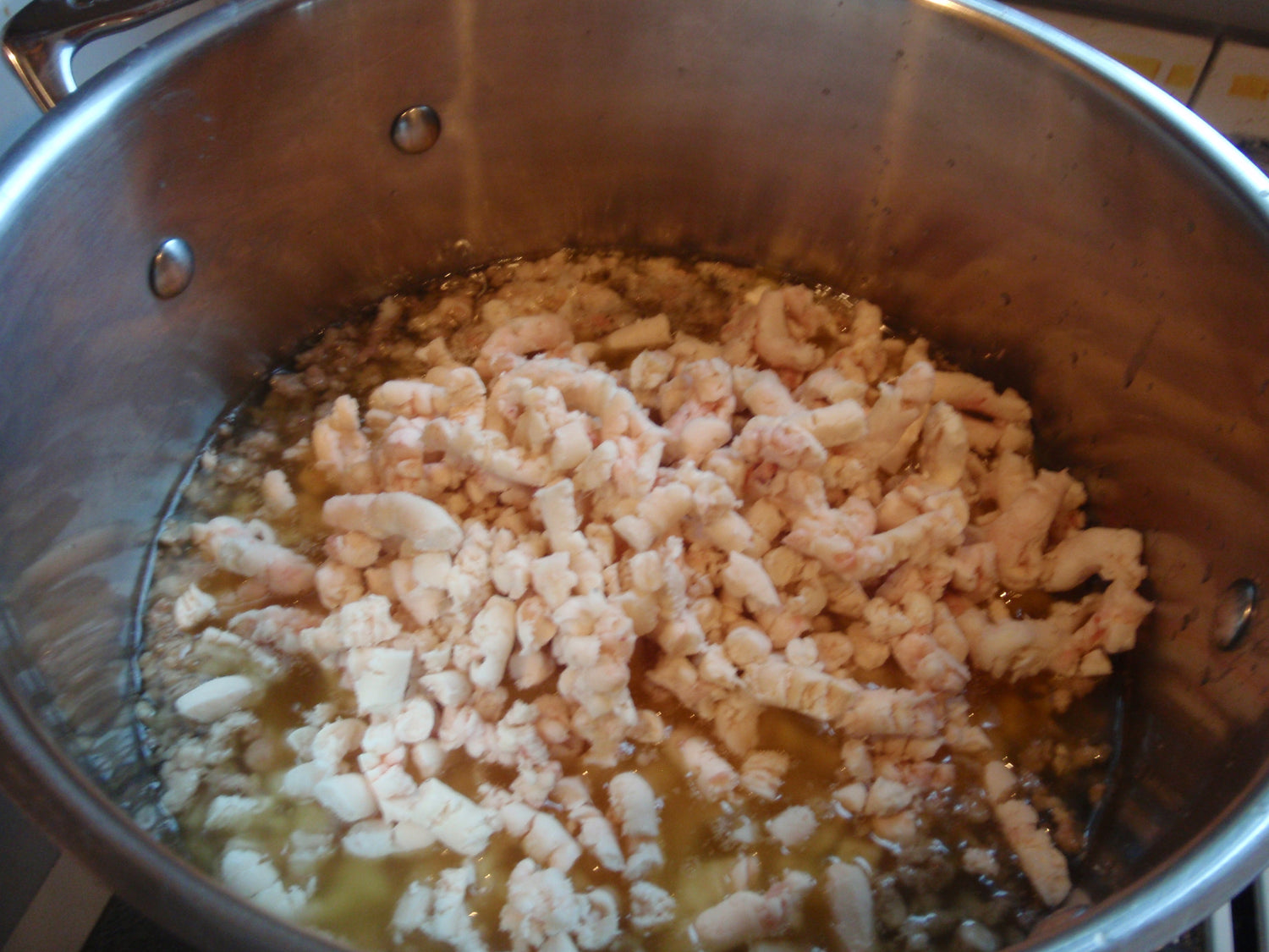 a pot full of raw grass fed beef suet rendering into tallow