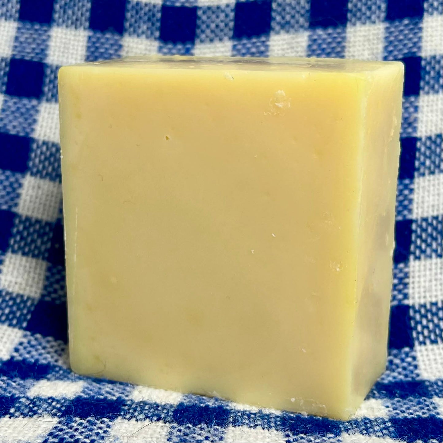 Bar of soap on a blue and white checkered cloth