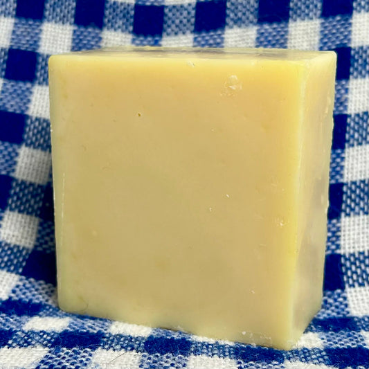 Bar of soap on a blue and white checkered cloth