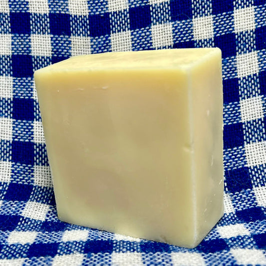 Bar of soap on a blue and white checkered cloth