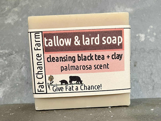 a bar of tallow and lard soap with added tea and clay